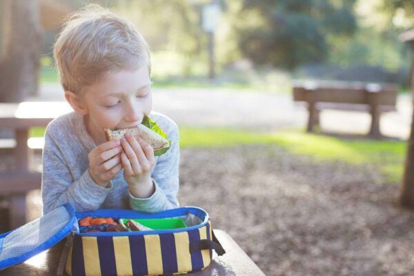 kid eating lunch at school