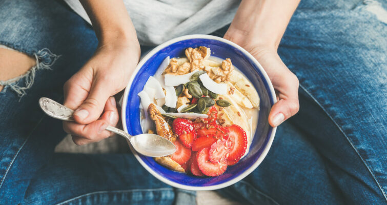 Yogurt, granola, seeds, fresh, dry fruits and honey in bowl