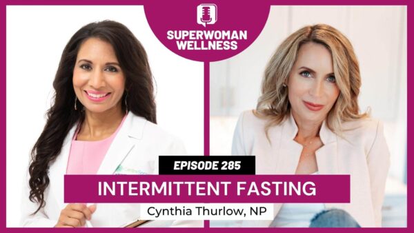 Two women in white coats discussing intermittent fasting, emphasizing health and nutrition concepts.