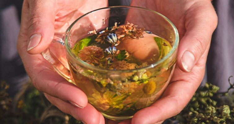 A man and woman in white robes relax together in a bathtub, symbolizing wellness and hormone balance.