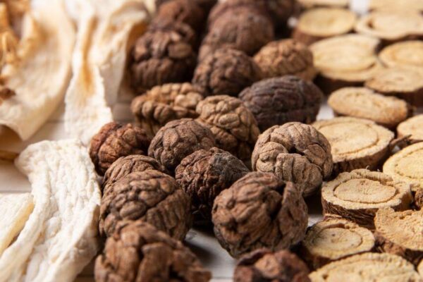 Chinese herbs and dried herbs arranged artistically, highlighting their significance in traditional Chinese medicine practices.