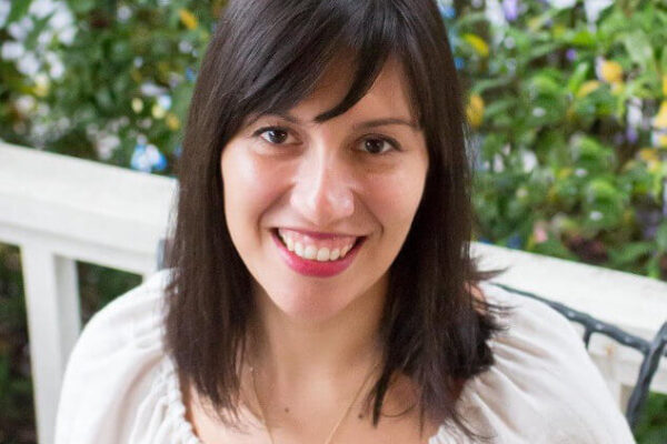A woman with dark hair wearing a white shirt, identified as Margot Witteveen, Registered Dietician.