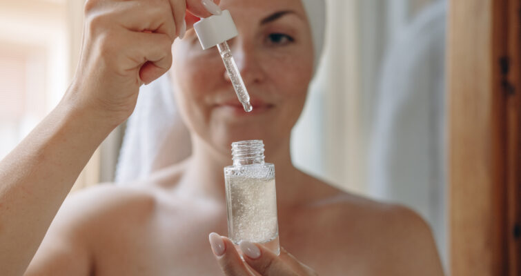woman with a bottle of peptides for peptide therapy