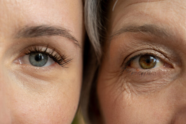 a close-up of a woman's eye aging showing the importance of mitochondria in the aging process