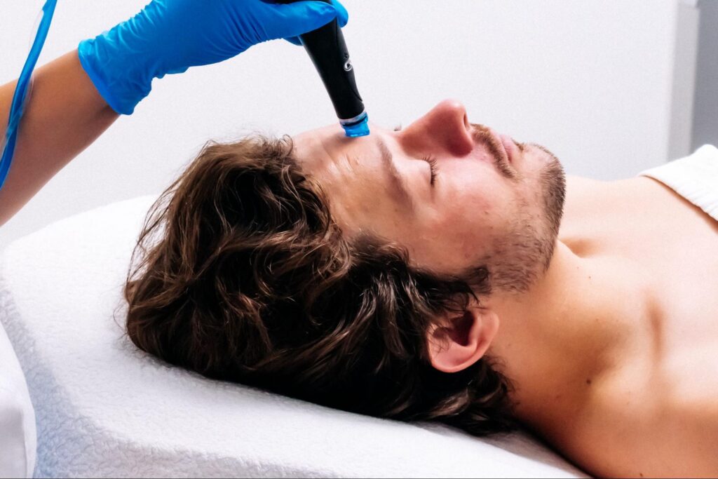 A man getting a HydraFacial