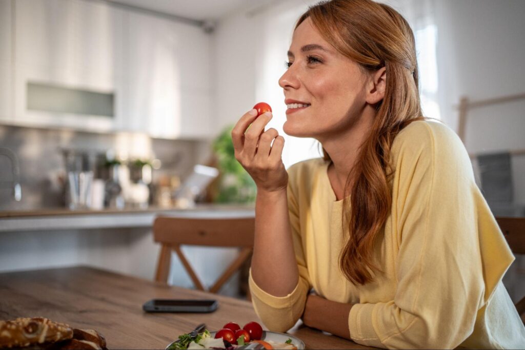 A woman eating a healthy salad