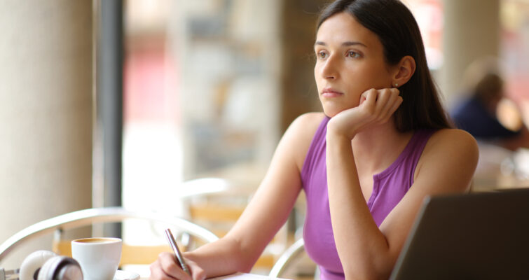 Woman dozing off, not focusing on the task at hand.