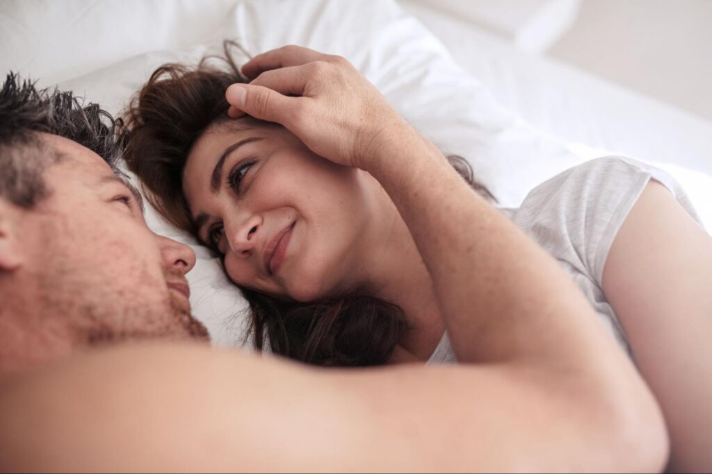 A happy couple in bed