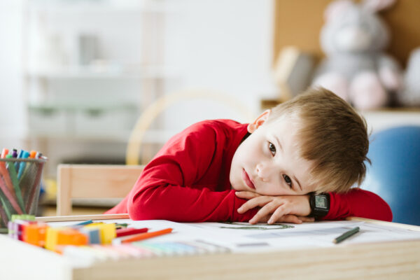 Exhausted child laying his head on a desk