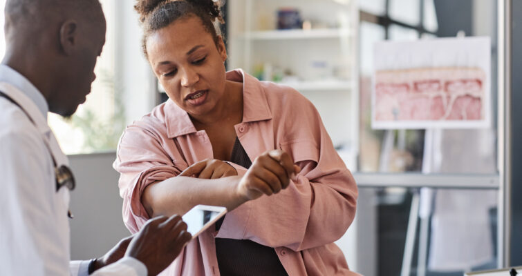 Adult woman meeting with doctor about her autoimmune disease