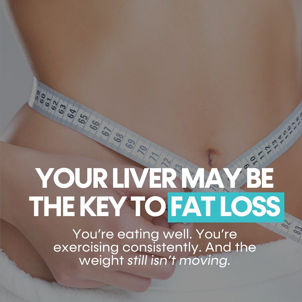 A person is measuring their waist with a tape measure while wearing a white towel.