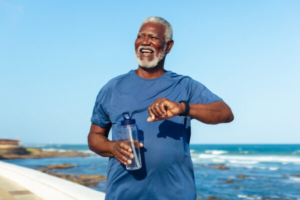 Older man looking enthusiastic and healthy - focusing on longevity.