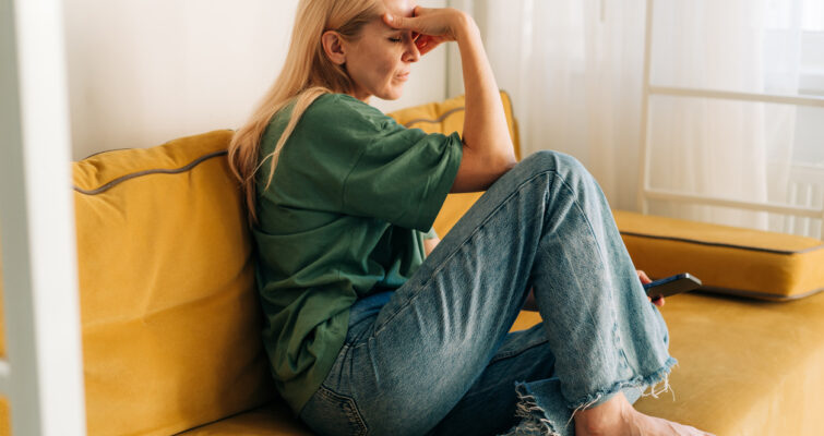 Woman dealing with symptoms of low estrogen